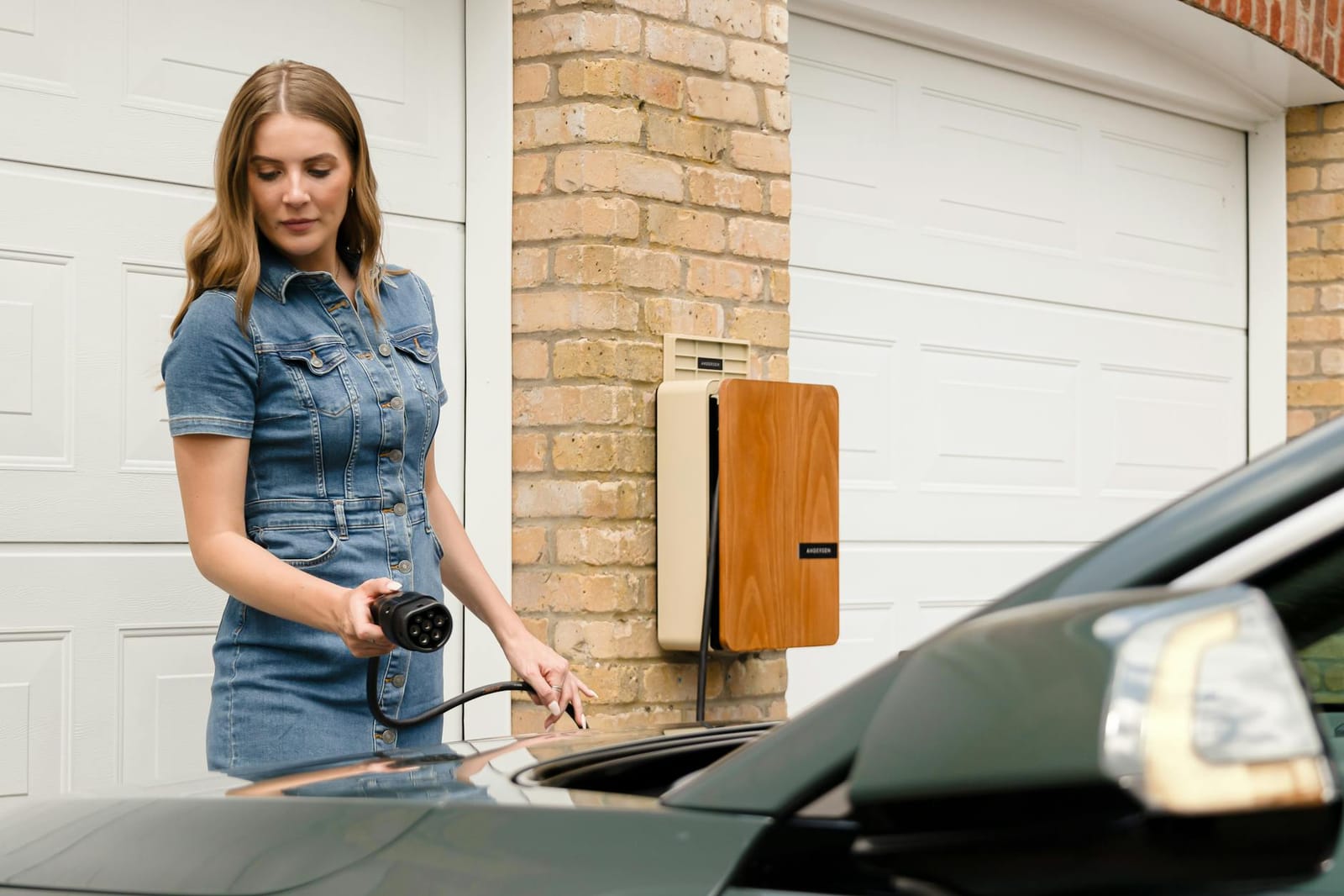 Designer EV wallbox charger mounted on the wall of a UK house