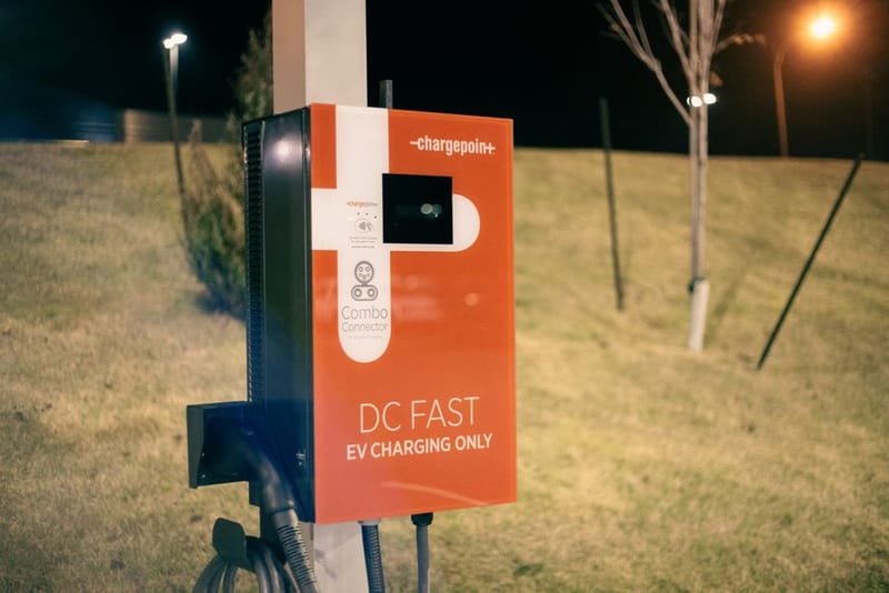Electric car charging at night, dashboard showing overnight charge