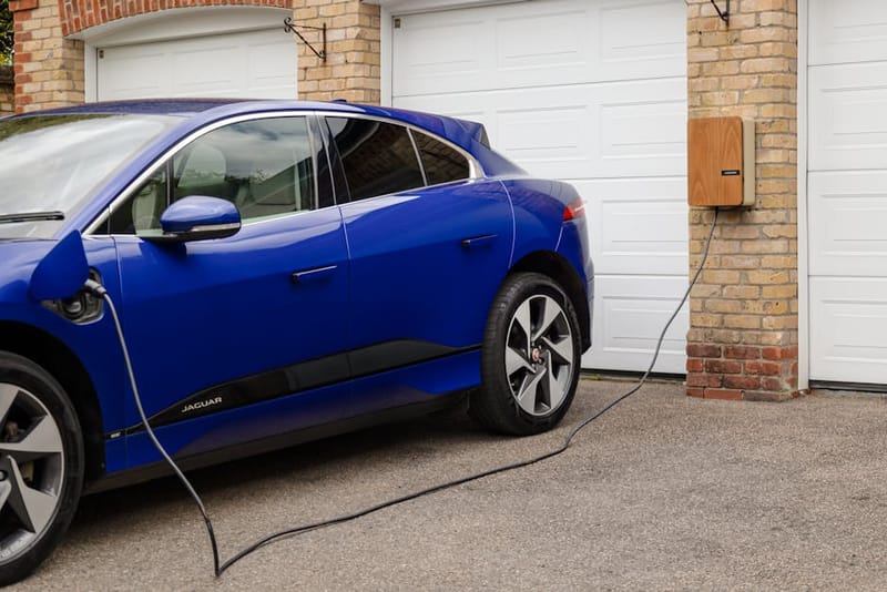 Electric vehicle plugged in for overnight charging