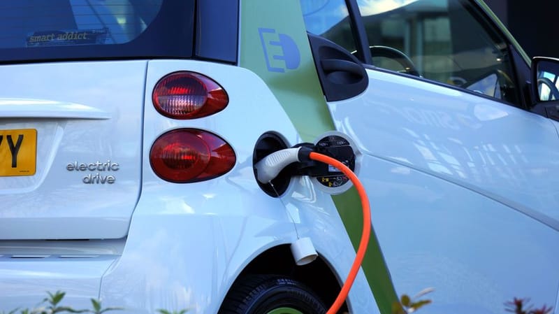 EV charging outside a home at night